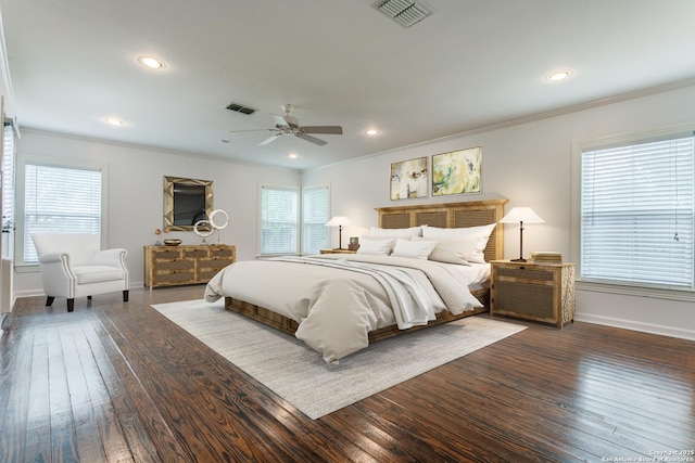 bedroom with multiple windows, ceiling fan, and dark wood-type flooring