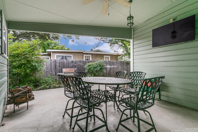 view of patio featuring ceiling fan