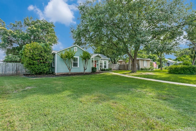 ranch-style house with a front yard