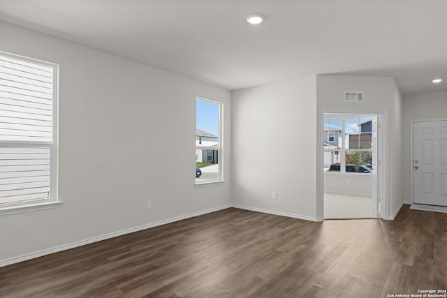 spare room featuring dark hardwood / wood-style floors