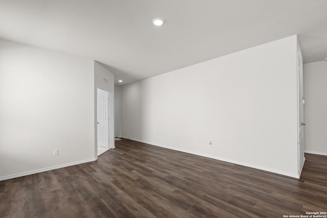 unfurnished room featuring dark hardwood / wood-style floors