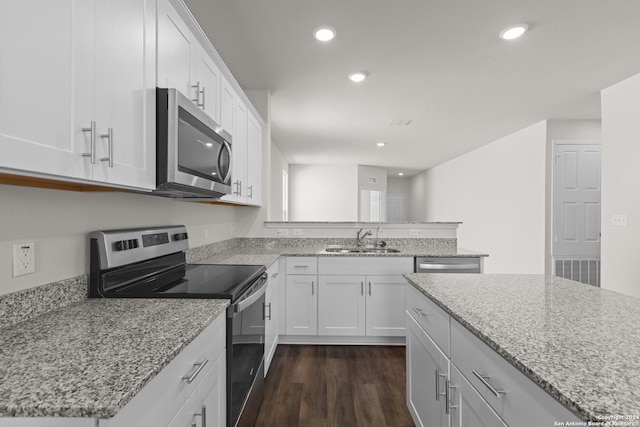 kitchen featuring white cabinets, stainless steel appliances, and sink