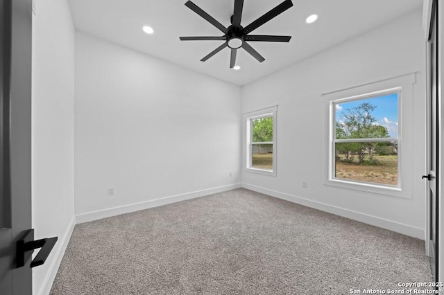 carpeted empty room with ceiling fan