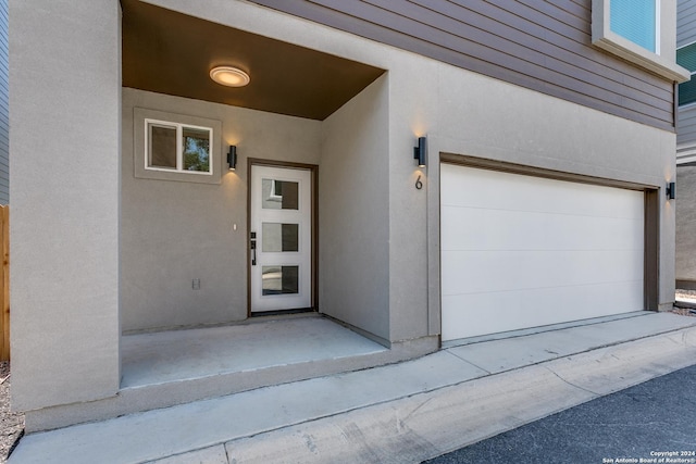 entrance to property featuring a garage