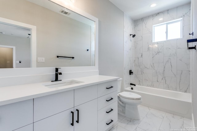 full bathroom featuring vanity, toilet, and tiled shower / bath