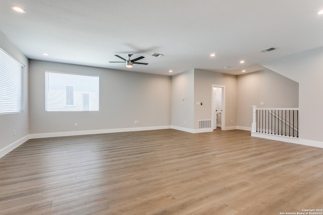 spare room featuring ceiling fan and light hardwood / wood-style flooring