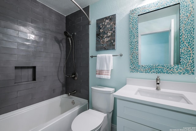 full bathroom with toilet, vanity, a textured ceiling, and tiled shower / bath