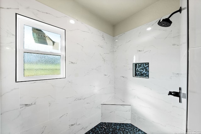 bathroom with tiled shower