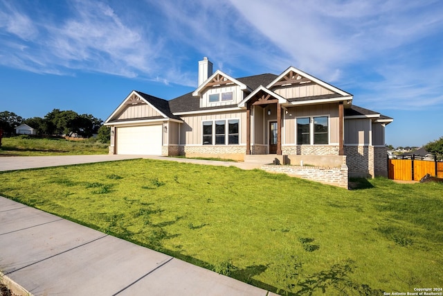 craftsman-style home featuring a front yard and a garage