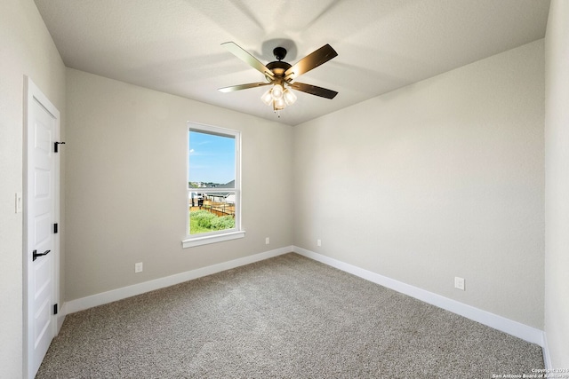 carpeted empty room with ceiling fan