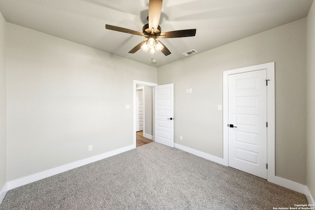 unfurnished bedroom with carpet flooring and ceiling fan