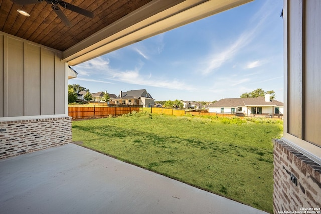 view of yard featuring ceiling fan and a patio area