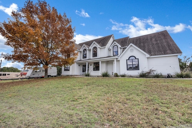 view of front of property featuring a front lawn and covered porch