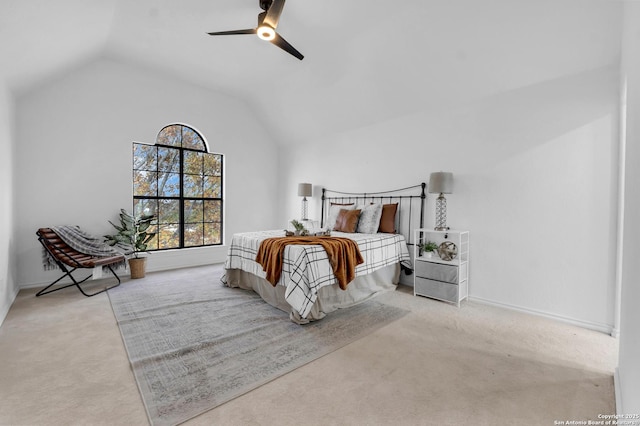 bedroom featuring ceiling fan, light carpet, and vaulted ceiling