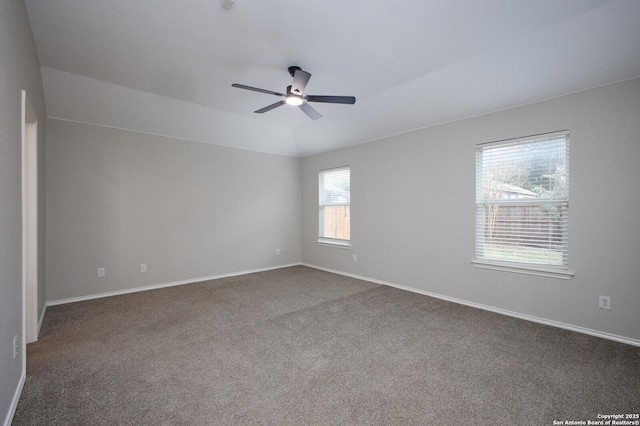 carpeted spare room with ceiling fan