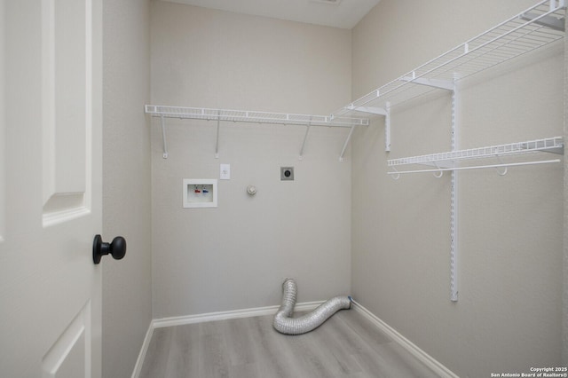 laundry room featuring hookup for an electric dryer, gas dryer hookup, hardwood / wood-style floors, and hookup for a washing machine