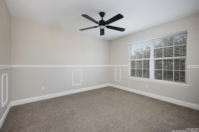 empty room featuring carpet flooring and ceiling fan