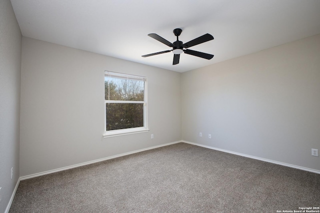 spare room with carpet and ceiling fan