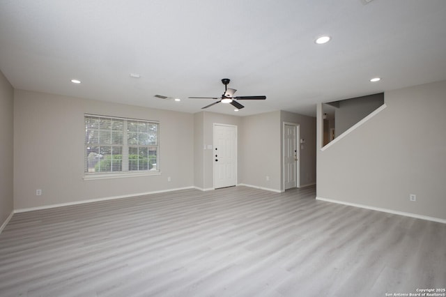 unfurnished living room featuring light hardwood / wood-style flooring and ceiling fan