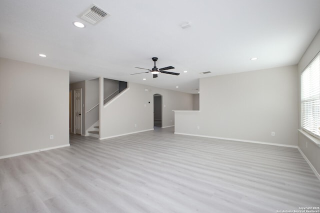 unfurnished living room with light hardwood / wood-style floors and ceiling fan