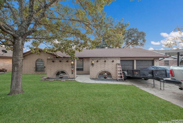 back of property featuring a garage and a yard