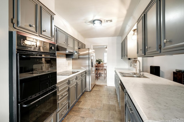 kitchen with sink, ceiling fan, and black appliances