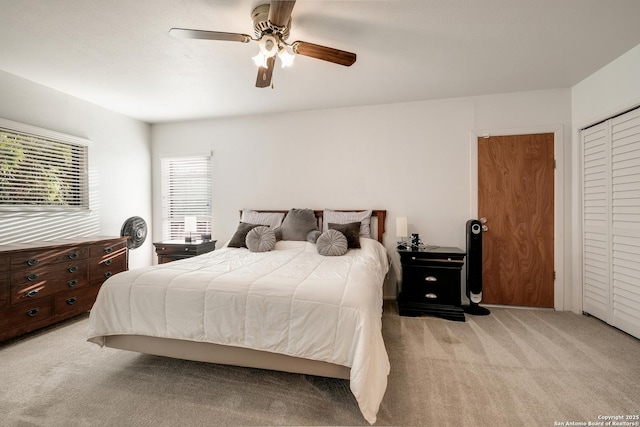 carpeted bedroom with ceiling fan