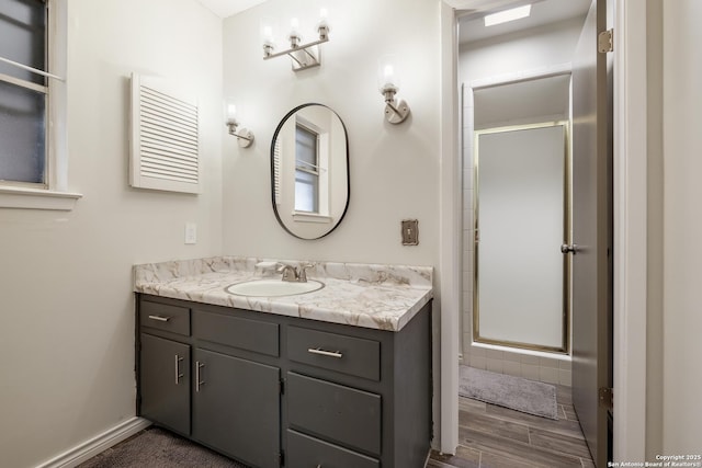 bathroom with vanity and an enclosed shower