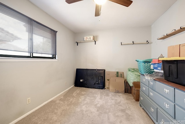 misc room with ceiling fan and light colored carpet