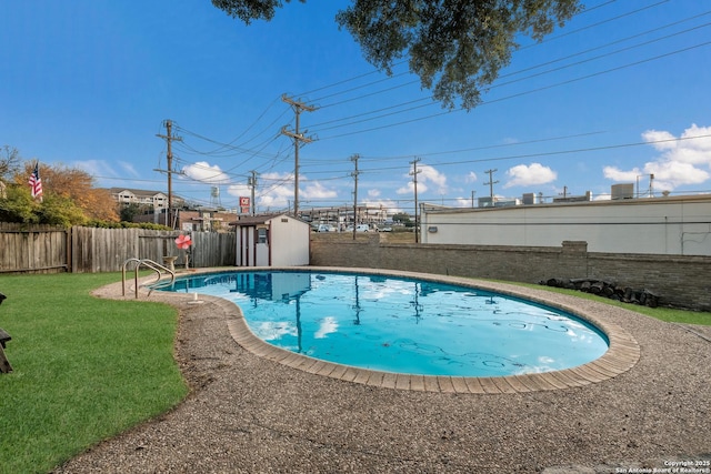 view of swimming pool with a shed