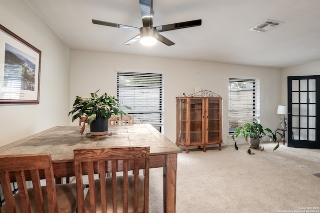 dining room featuring carpet and ceiling fan