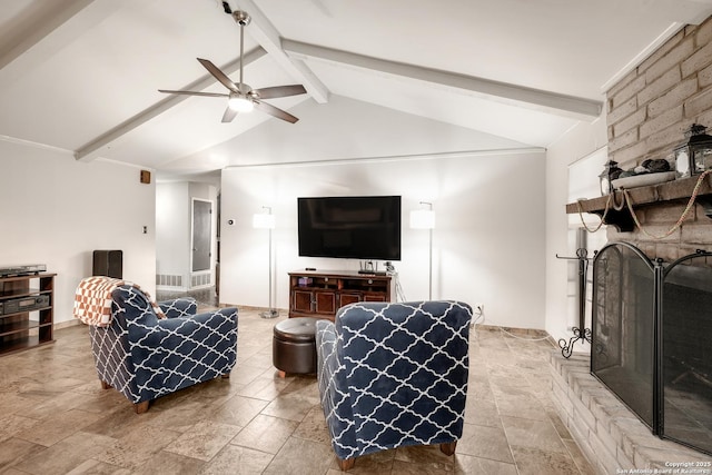 living room with vaulted ceiling with beams, ceiling fan, and a fireplace