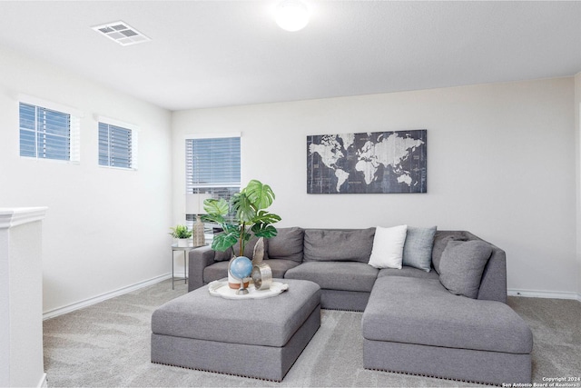 living room featuring light carpet