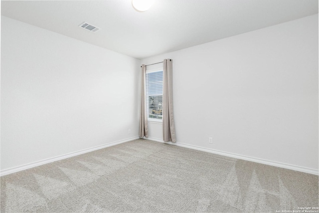 unfurnished room with carpet