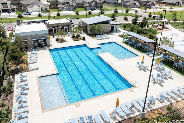 view of swimming pool featuring a patio area