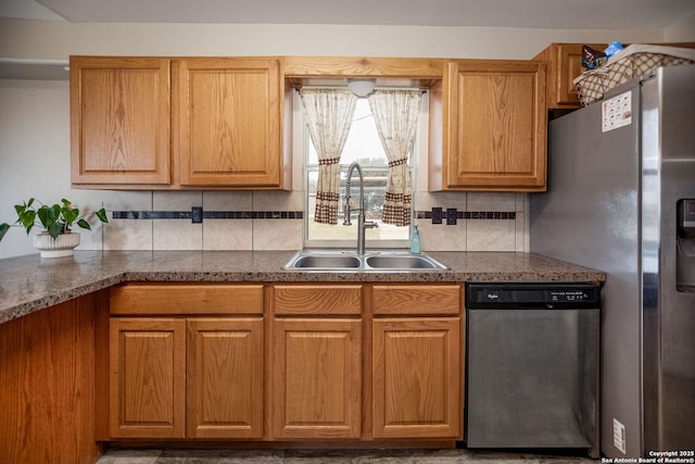 kitchen featuring tasteful backsplash, sink, and stainless steel appliances