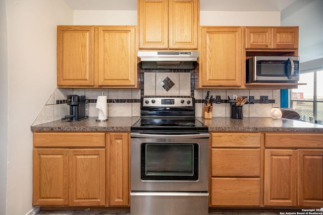 kitchen featuring decorative backsplash and appliances with stainless steel finishes