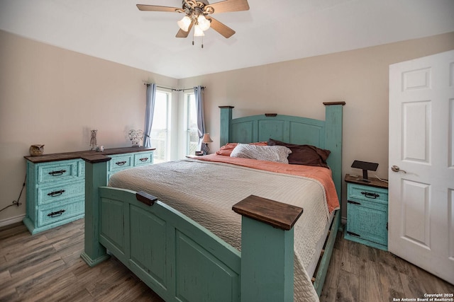 bedroom with wood-type flooring and ceiling fan