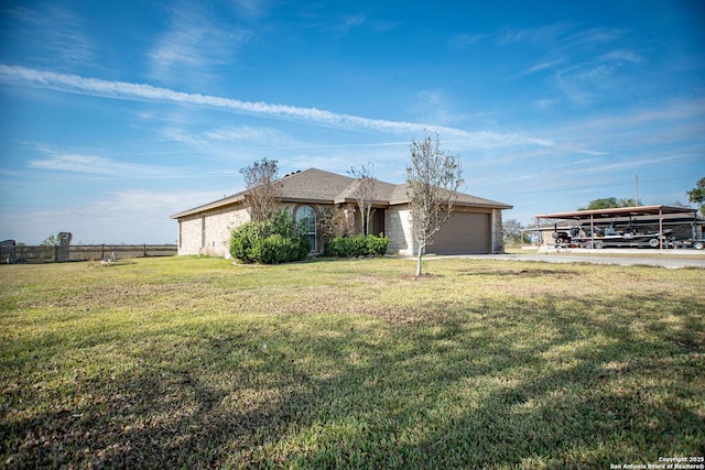 single story home with a carport, a garage, and a front lawn