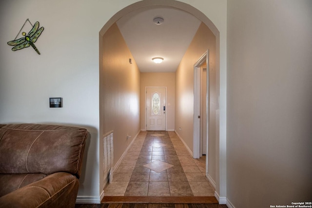 entryway featuring light tile patterned flooring