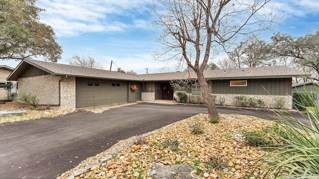 ranch-style house featuring a garage