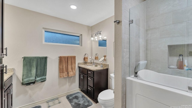 full bathroom featuring vanity, toilet, and tiled shower / bath