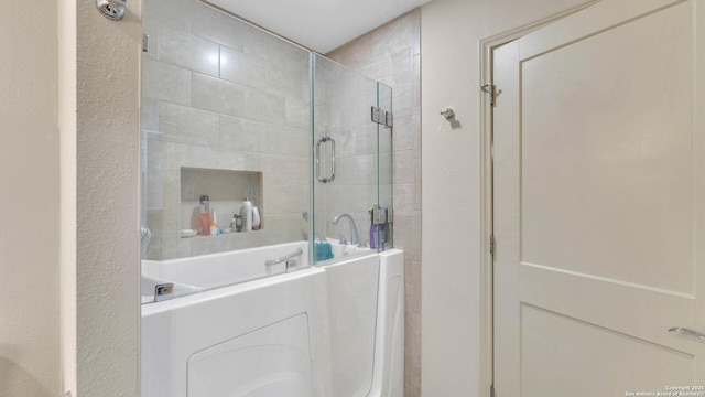 bathroom featuring walk in shower