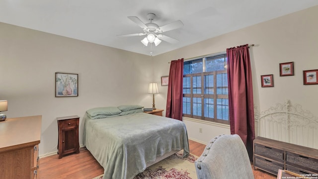 bedroom featuring light wood-type flooring and ceiling fan