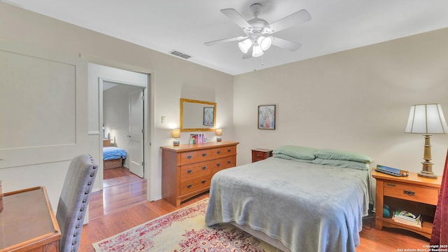 bedroom with ceiling fan and light wood-type flooring