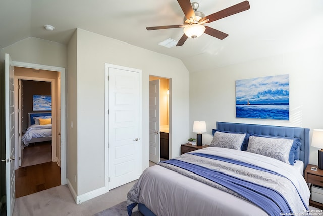 bedroom with carpet flooring, ceiling fan, a baseboard radiator, and vaulted ceiling