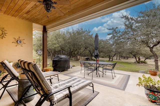 view of patio with a grill and ceiling fan