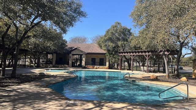 view of swimming pool featuring a pergola and a patio area