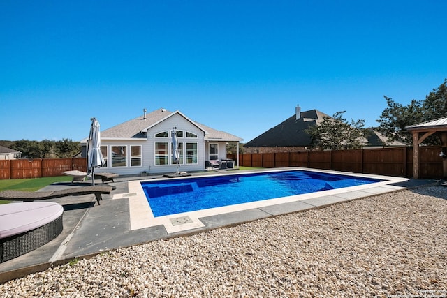 view of swimming pool featuring a patio area