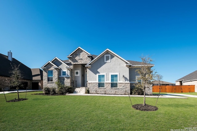 craftsman-style house with a front yard